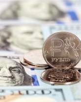 Рубль дорожает к евро и доллару