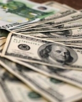 Доллар потерял еще 65 копеек
