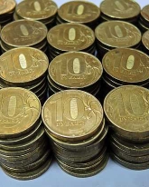 Рубль вырос к доллару и евро 