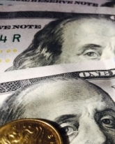 Доллар теряет еще 24 копейки в пятницу