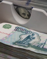 Рубль вырос на 19 копеек