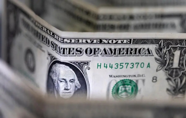 The dollar held firm after good U.S. jobs data, the lira hit a record low